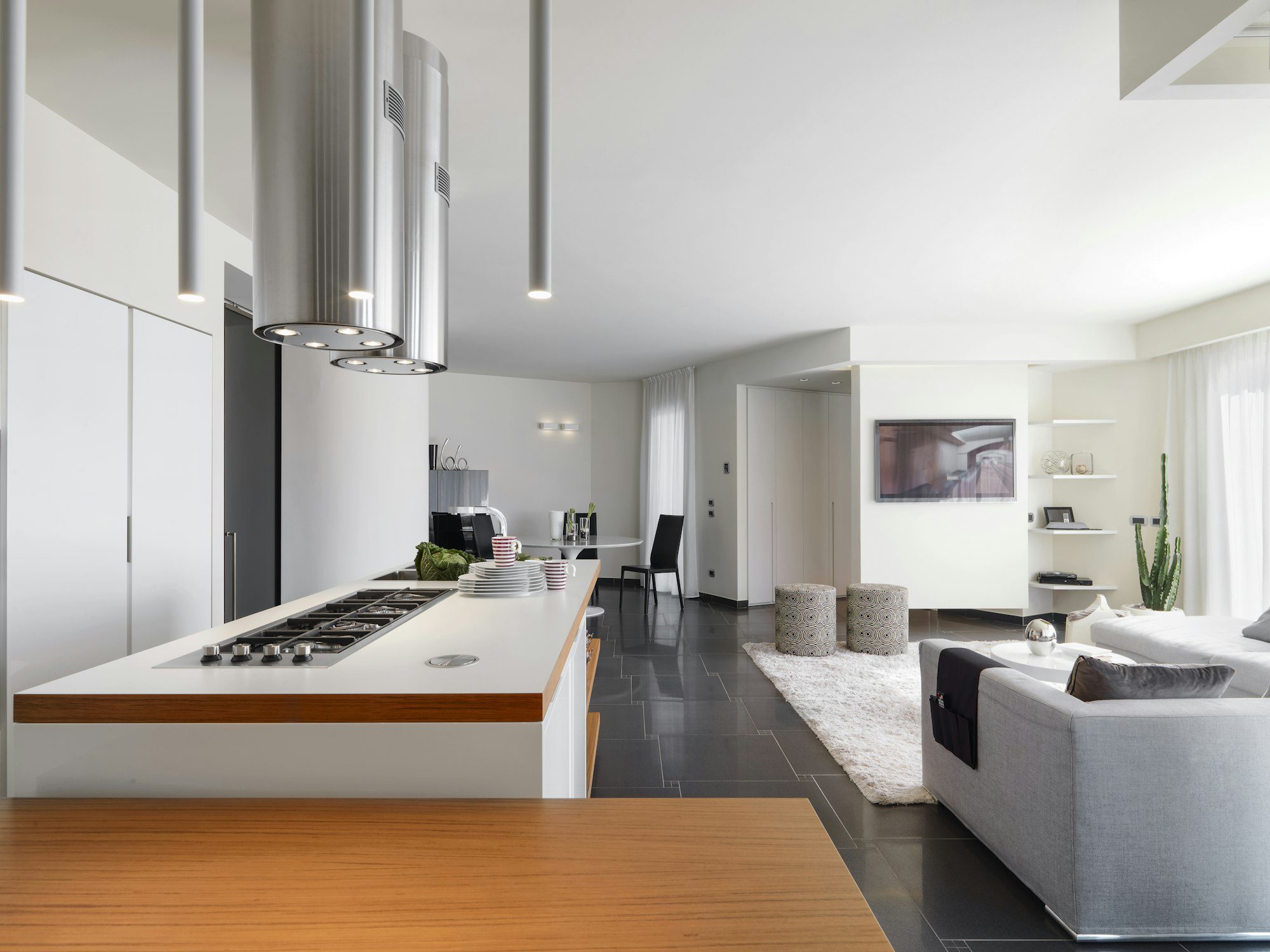 interiors of the modern kitchen with island kitchen overlooks on the living room